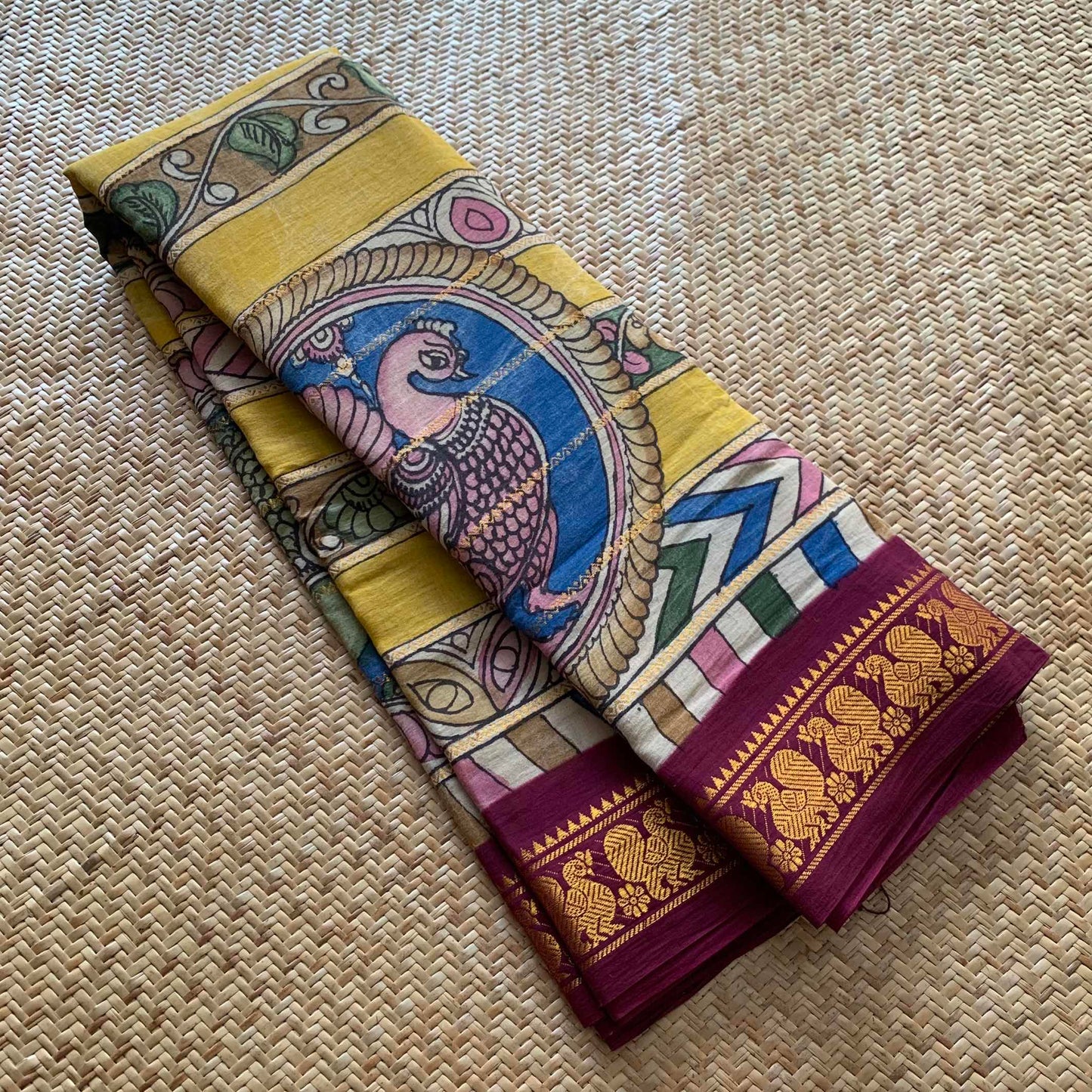 Multicoloured Kalamkari Hand Painted on a Madurai Velthari Sungudi Cotton saree.