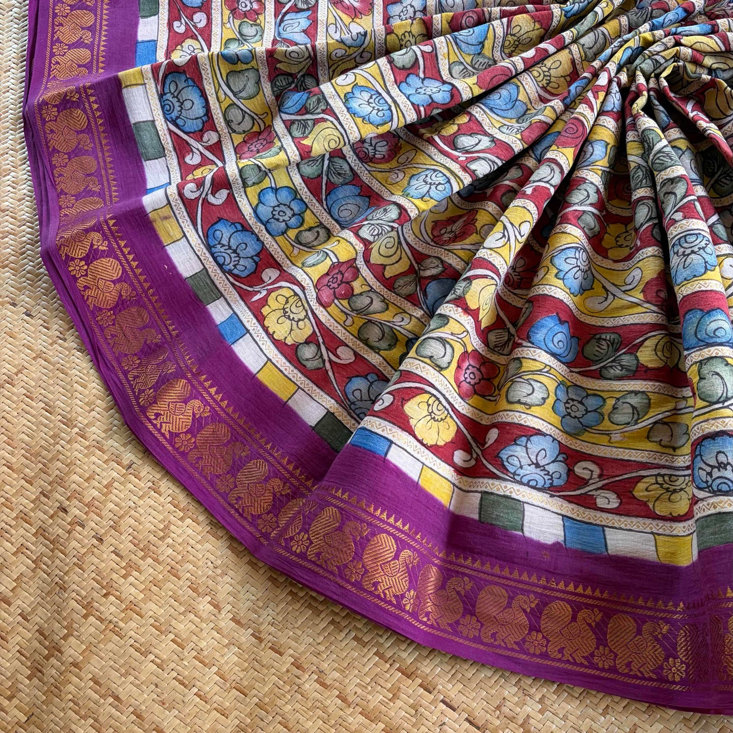 Multicoloured Kalamkari Hand Painted on a Madurai Velthari Sungudi Cotton saree.