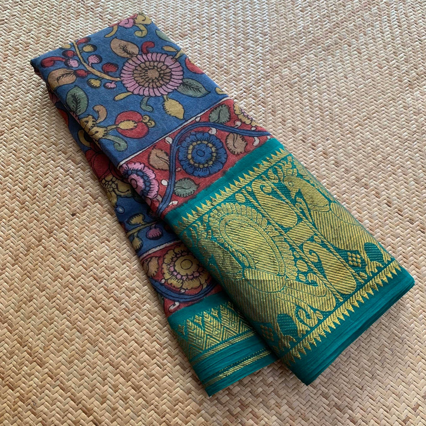 Blue Kalamkari Hand Painted on a Madurai Sungudi Cotton saree.