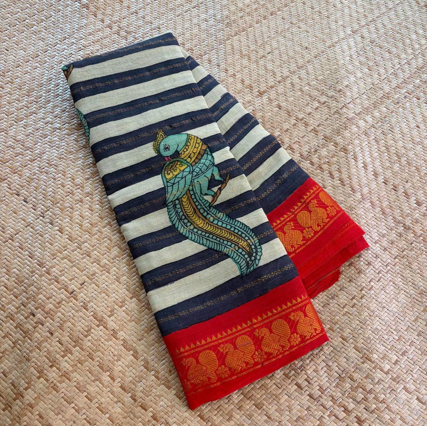 Multicoloured Kalamkari Hand Painted on a Madurai Velthari Sungudi Cotton saree.