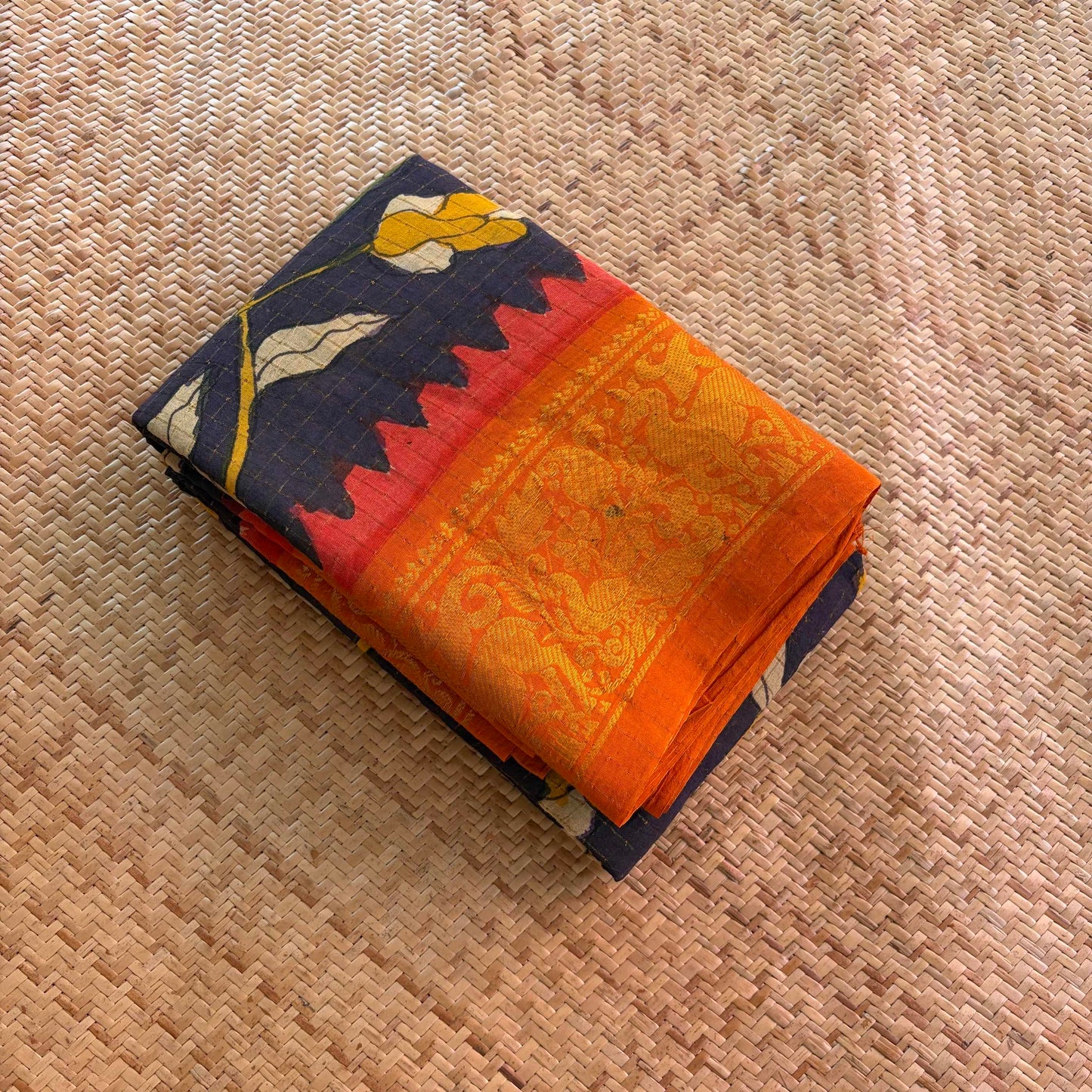 Black Floral Kalamkari Hand Painted on a Madurai Velthari Sungudi Cotton saree.