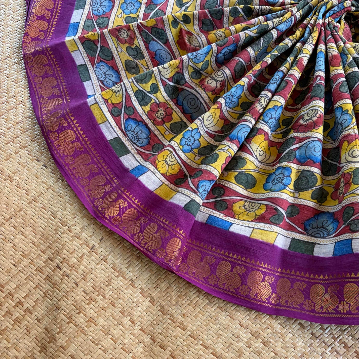 Multicoloured Kalamkari Hand Painted on a Madurai Velthari Sungudi Cotton saree.
