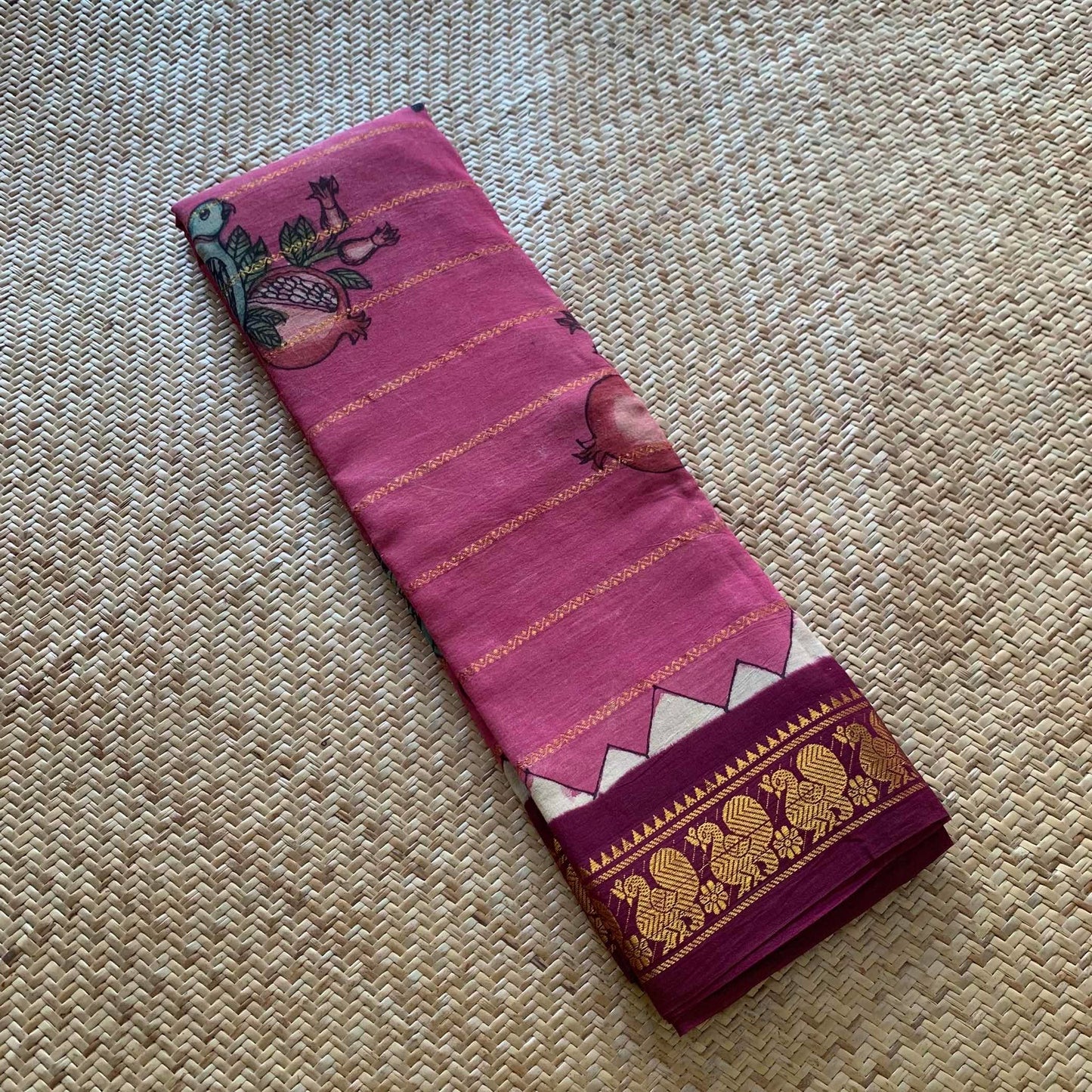 Parrot- Pomegranate Kalamkari Hand Painted on a Madurai Velthari Sungudi Cotton saree.