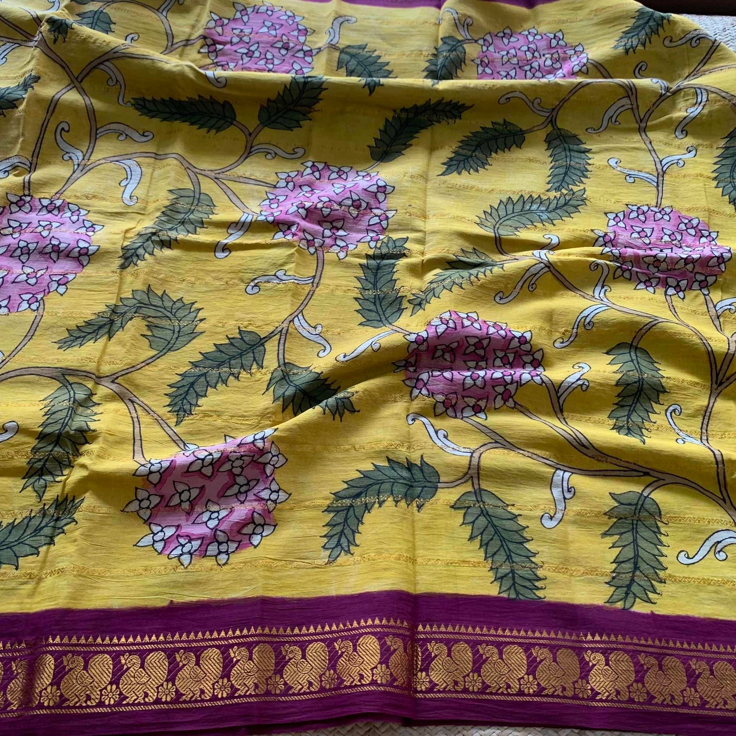 Mustard Kalamkari Hand Painted on a Madurai Velthari Sungudi Cotton saree.