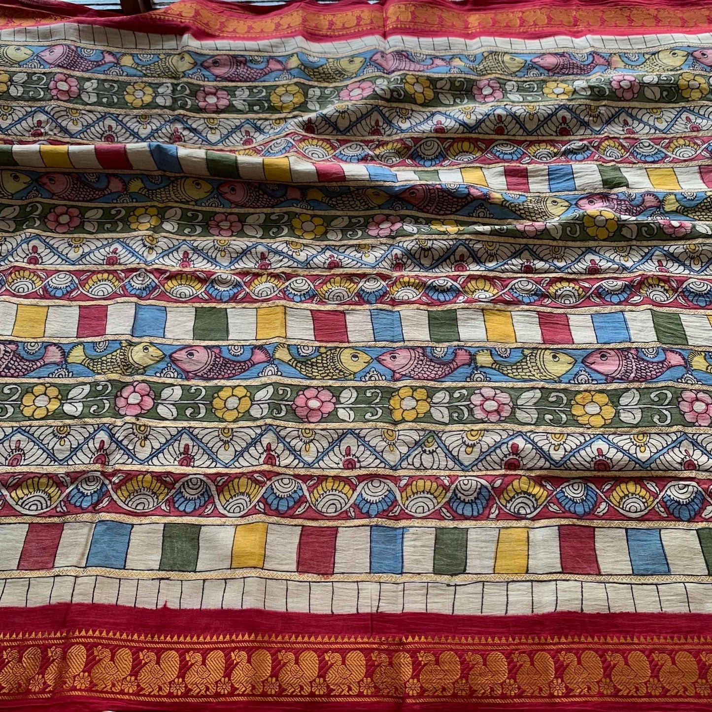 Multicoloured Kalamkari Hand Painted on a Madurai Velthari Sungudi Cotton saree.