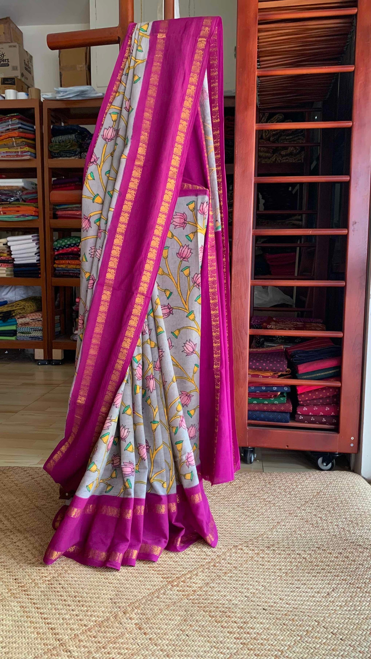 Grey Kalamkari Hand Painted on a Madurai Sungudi Cotton saree.