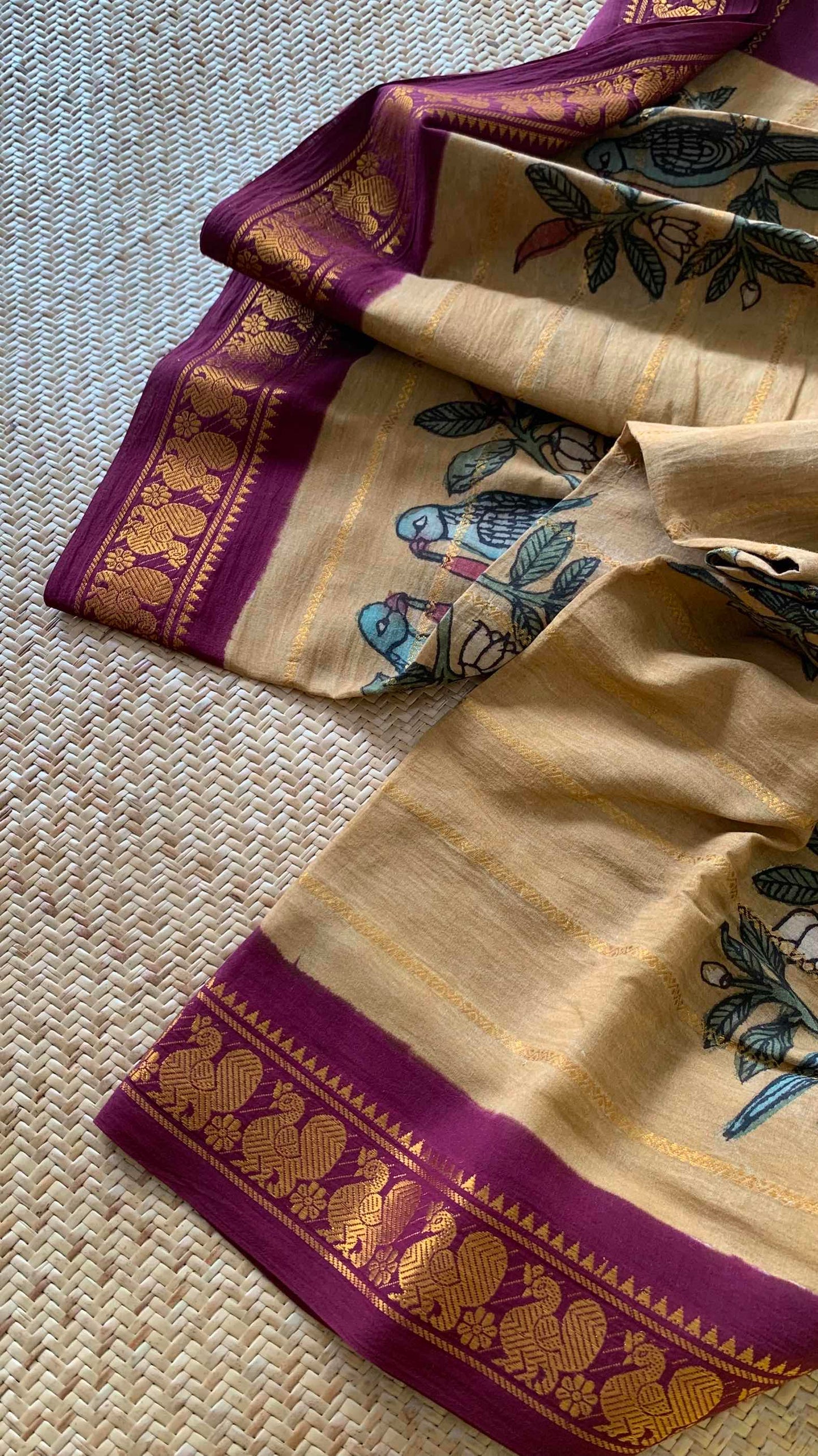 Parrot- chilli Kalamkari Hand Painted on a Madurai Velthari Sungudi Cotton saree.