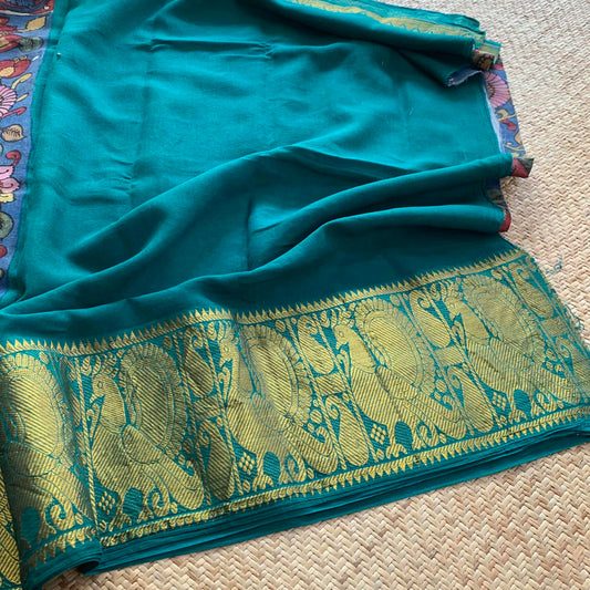 Blue Kalamkari Hand Painted on a Madurai Sungudi Cotton saree.