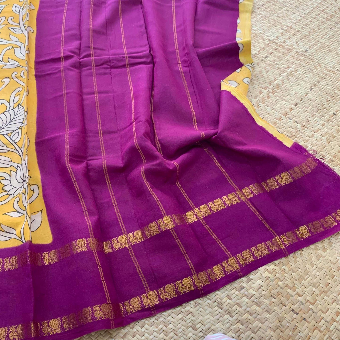 Floral Kalamkari Hand Painted on a Madurai Sungudi Cotton saree.