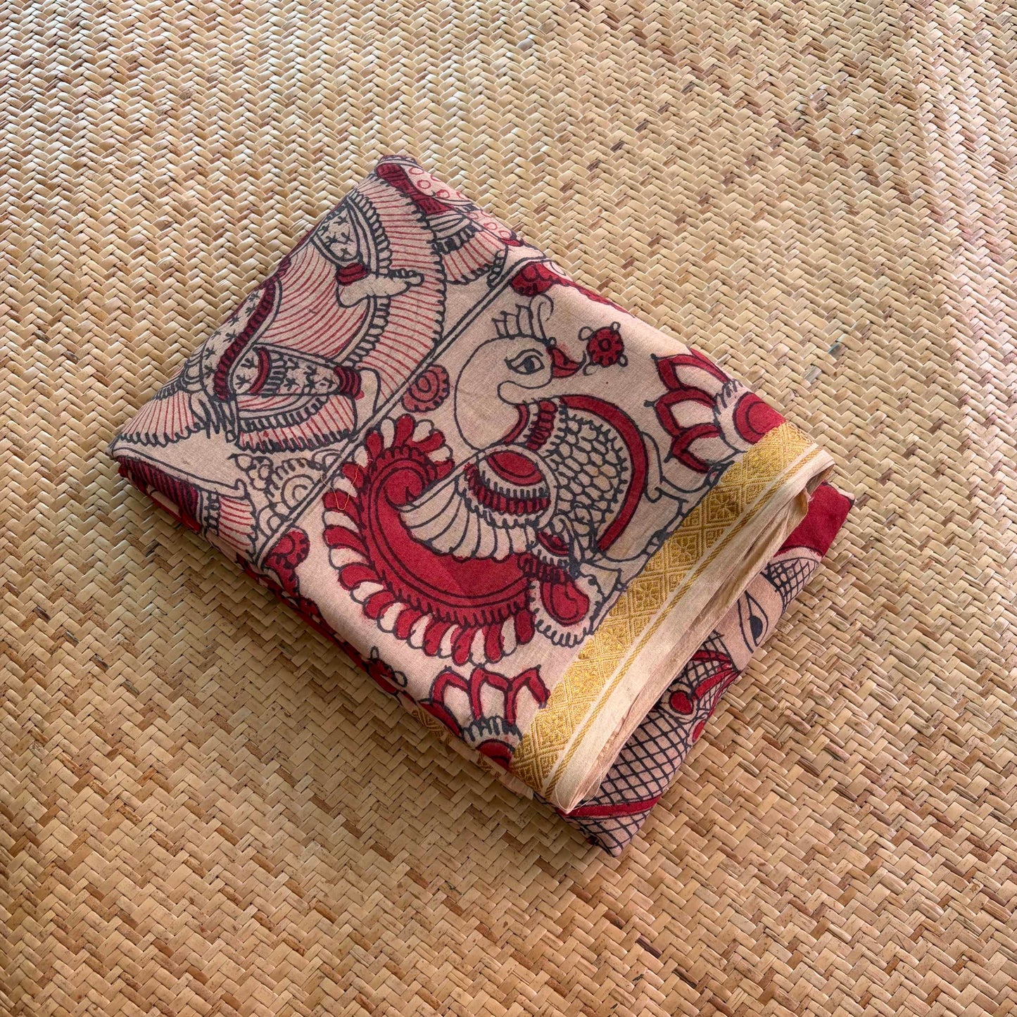Red Floral Kalamkari Hand Painted on a Madurai Velthari Sungudi Cotton saree.