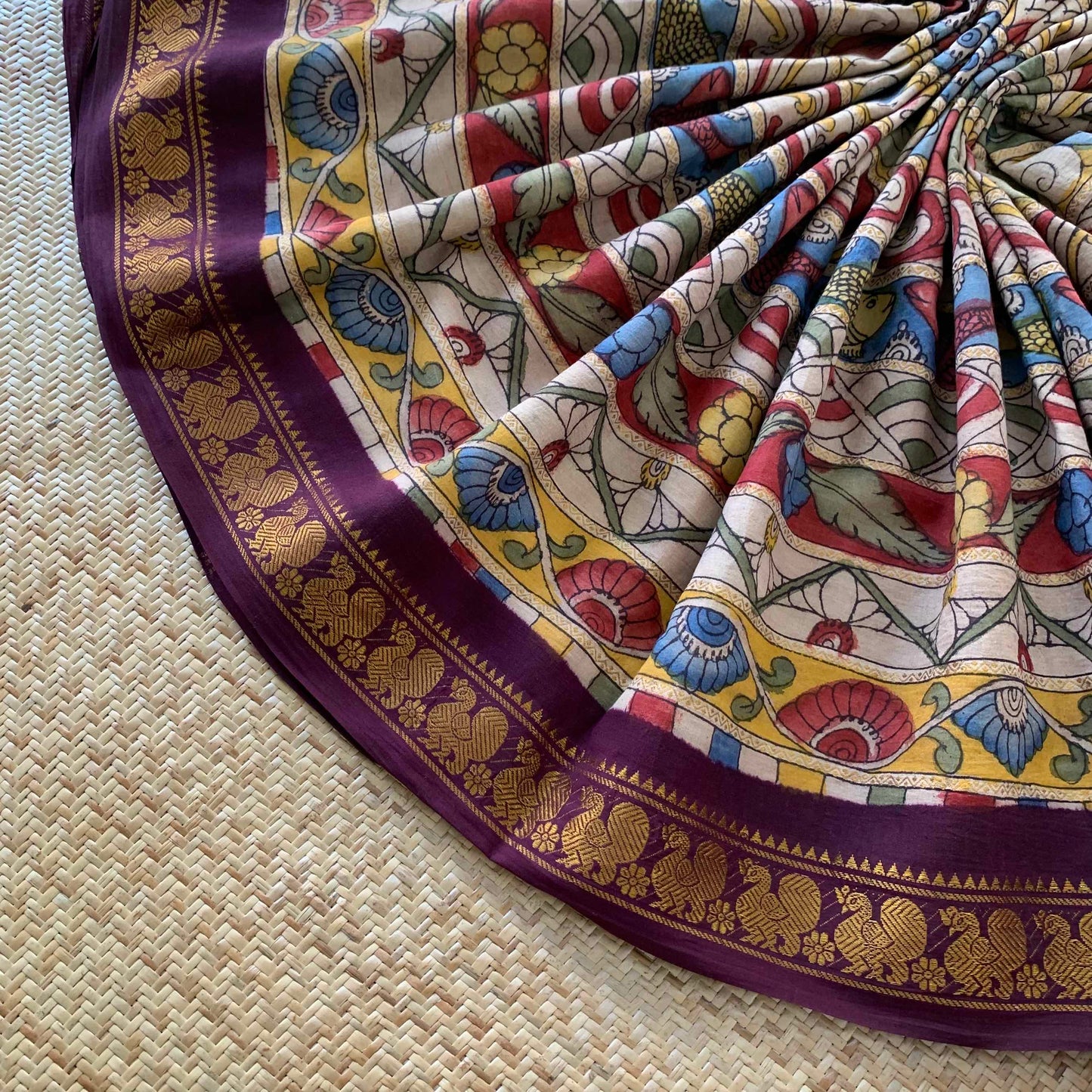 Multicoloured Kalamkari Hand Painted on a Madurai Velthari Sungudi Cotton saree.