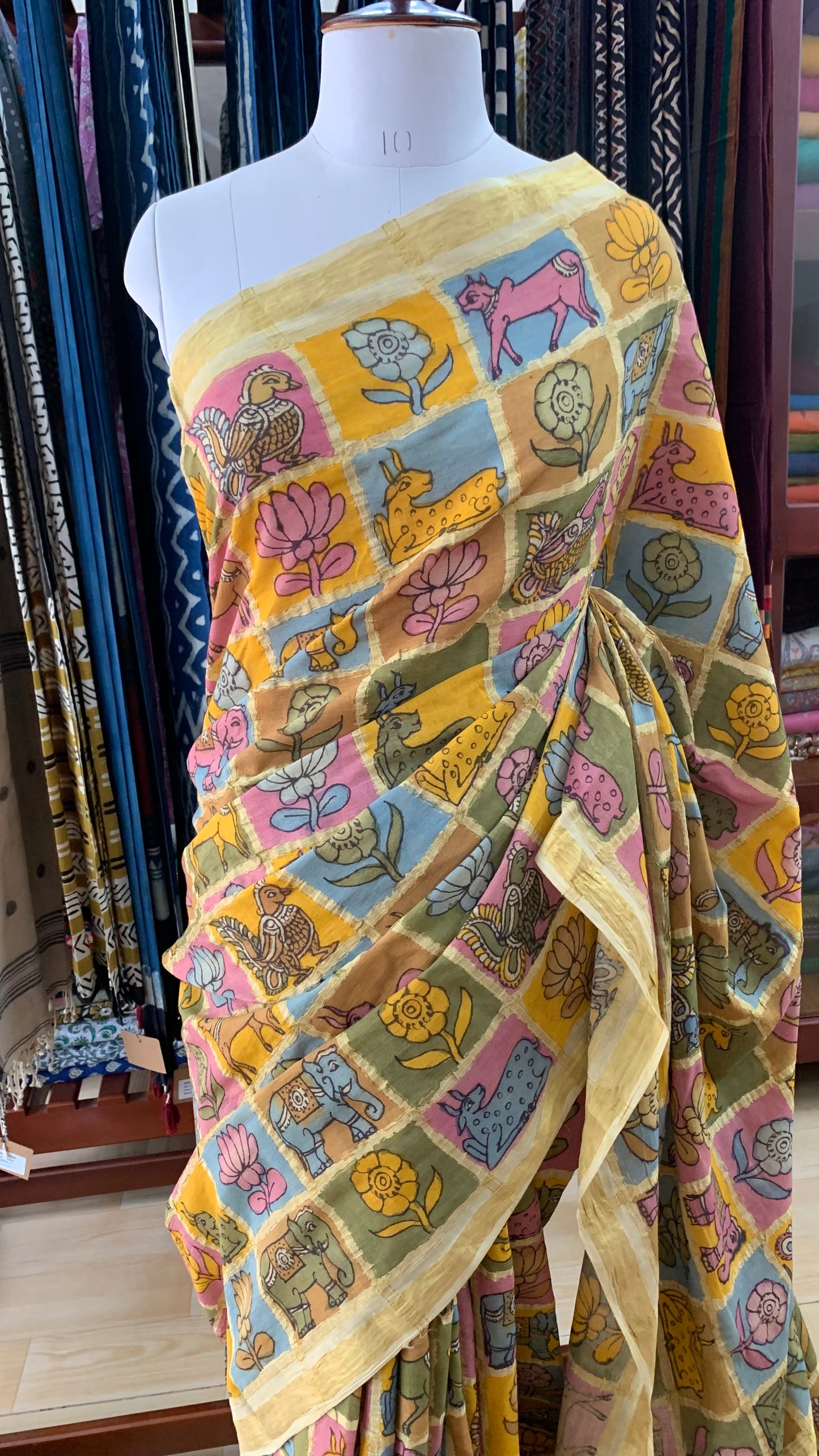 Flora and Fauna, Kalamkari Hand Painted on a Madurai Handwoven Sungudi Cotton saree.