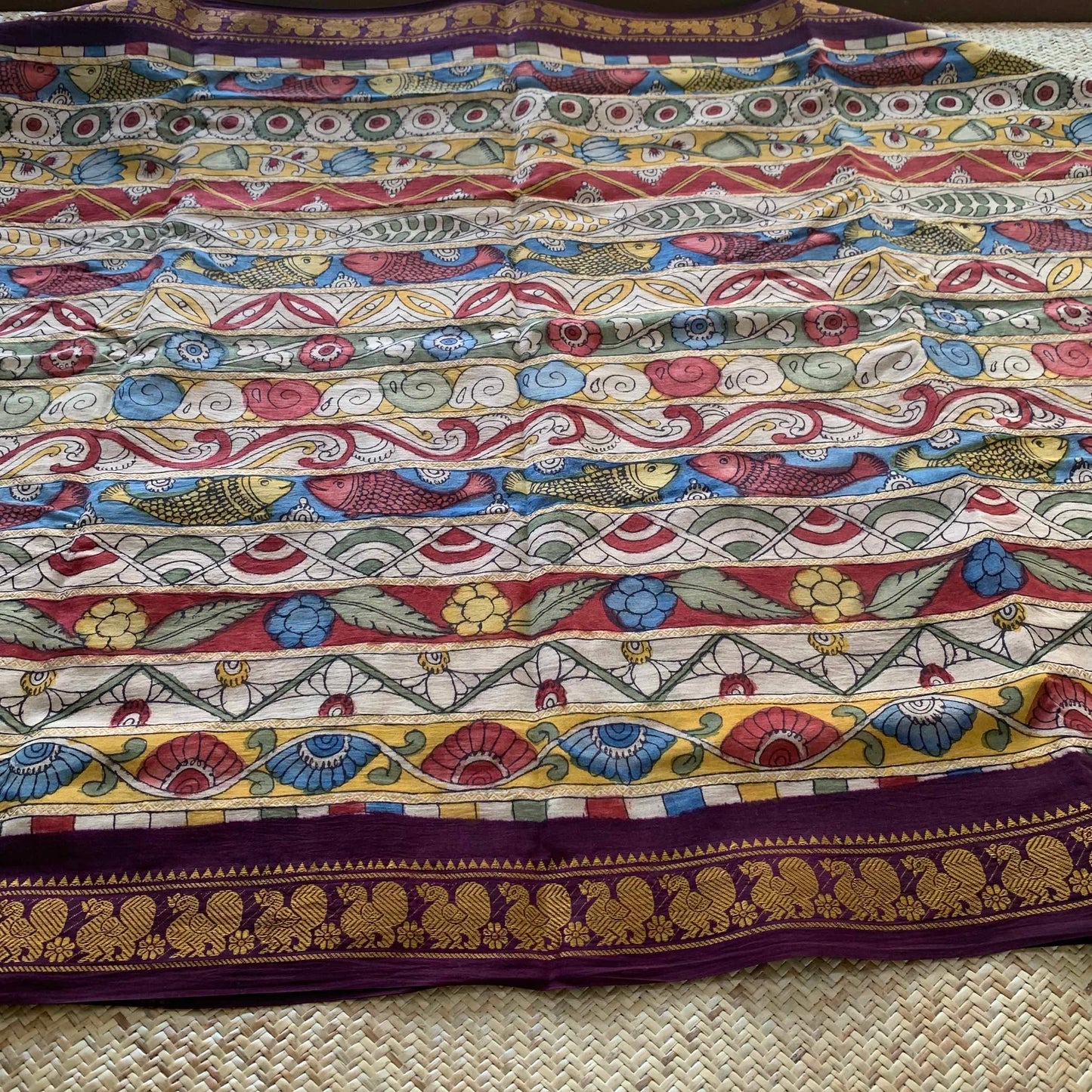 Multicoloured Kalamkari Hand Painted on a Madurai Velthari Sungudi Cotton saree.