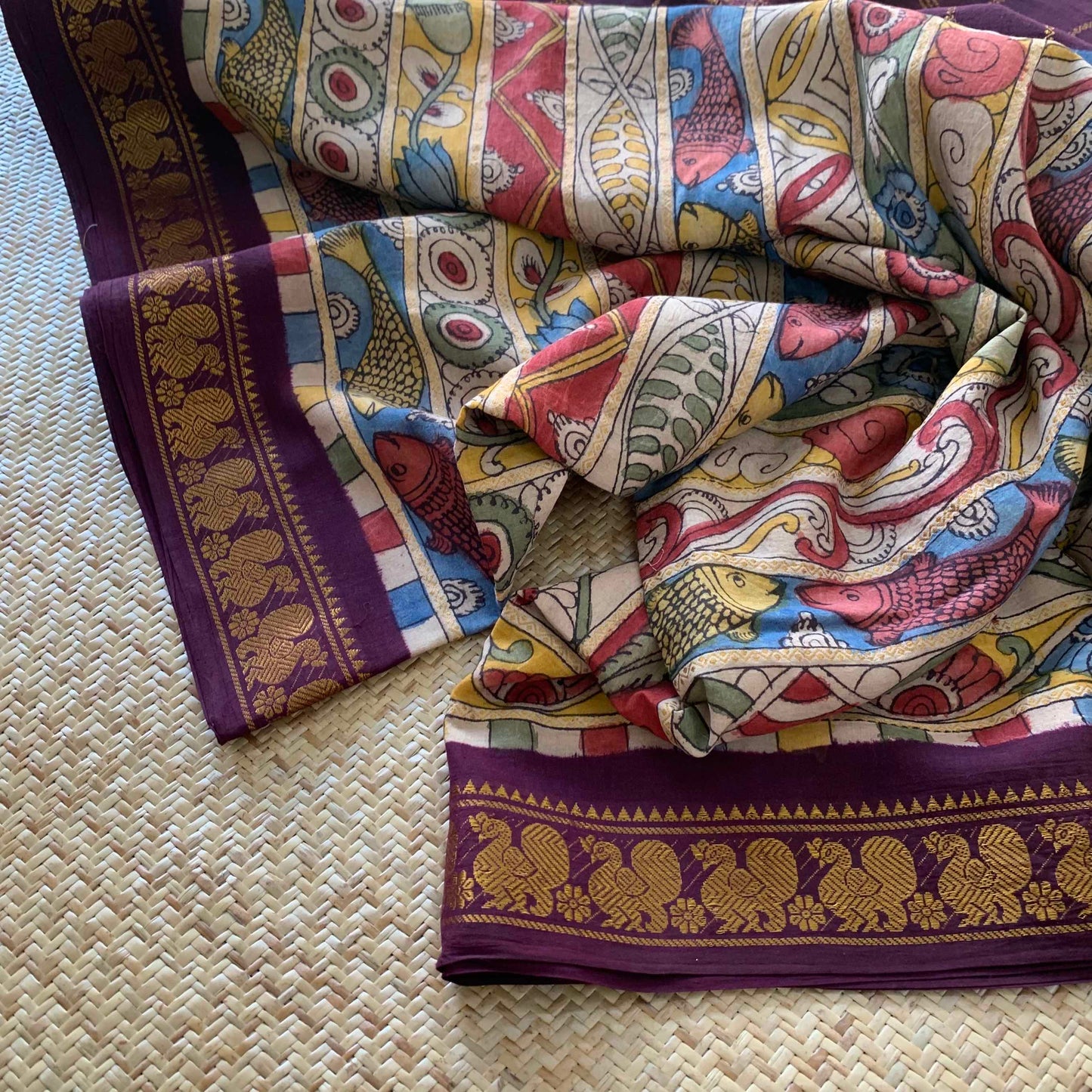 Multicoloured Kalamkari Hand Painted on a Madurai Velthari Sungudi Cotton saree.