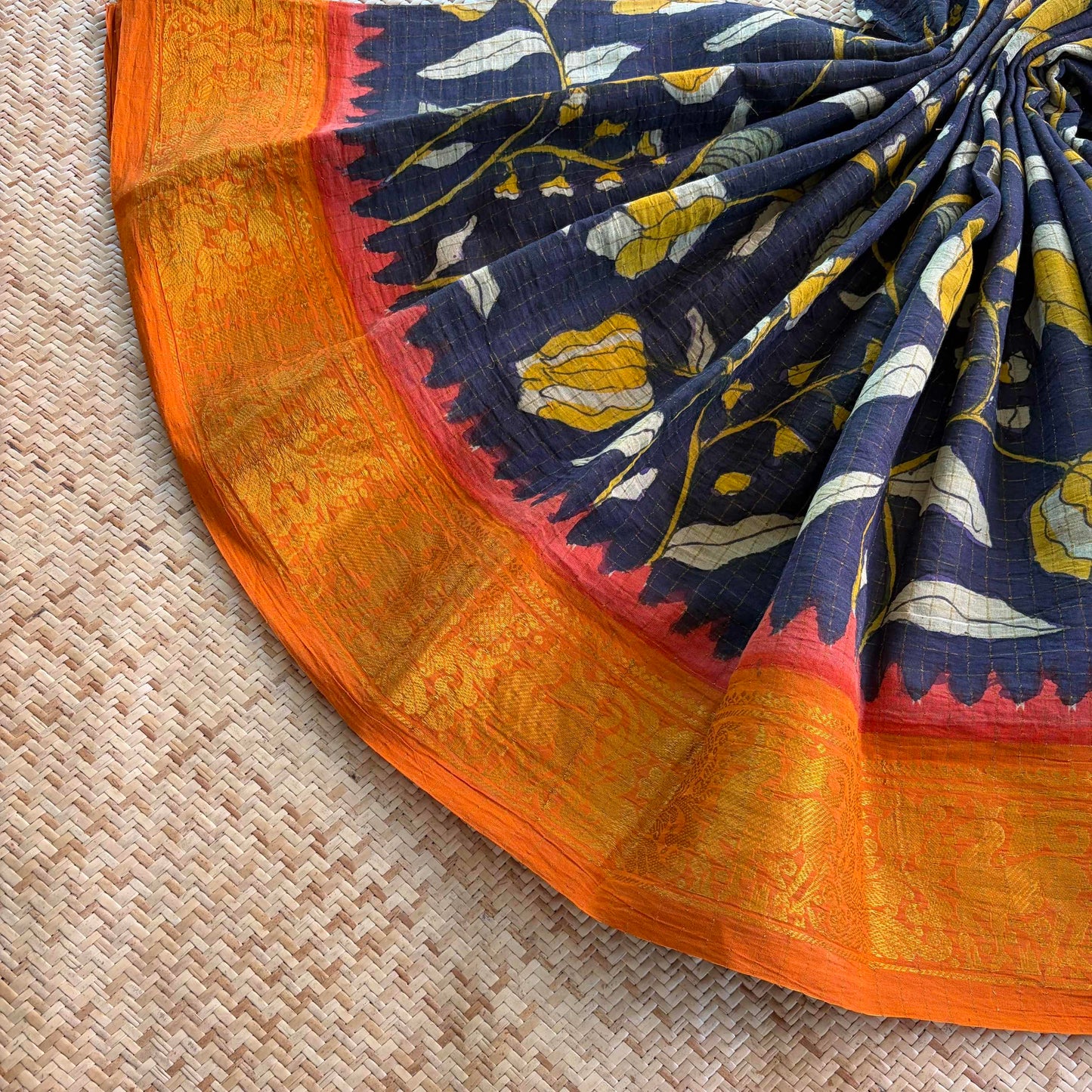 Black Floral Kalamkari Hand Painted on a Madurai Velthari Sungudi Cotton saree.