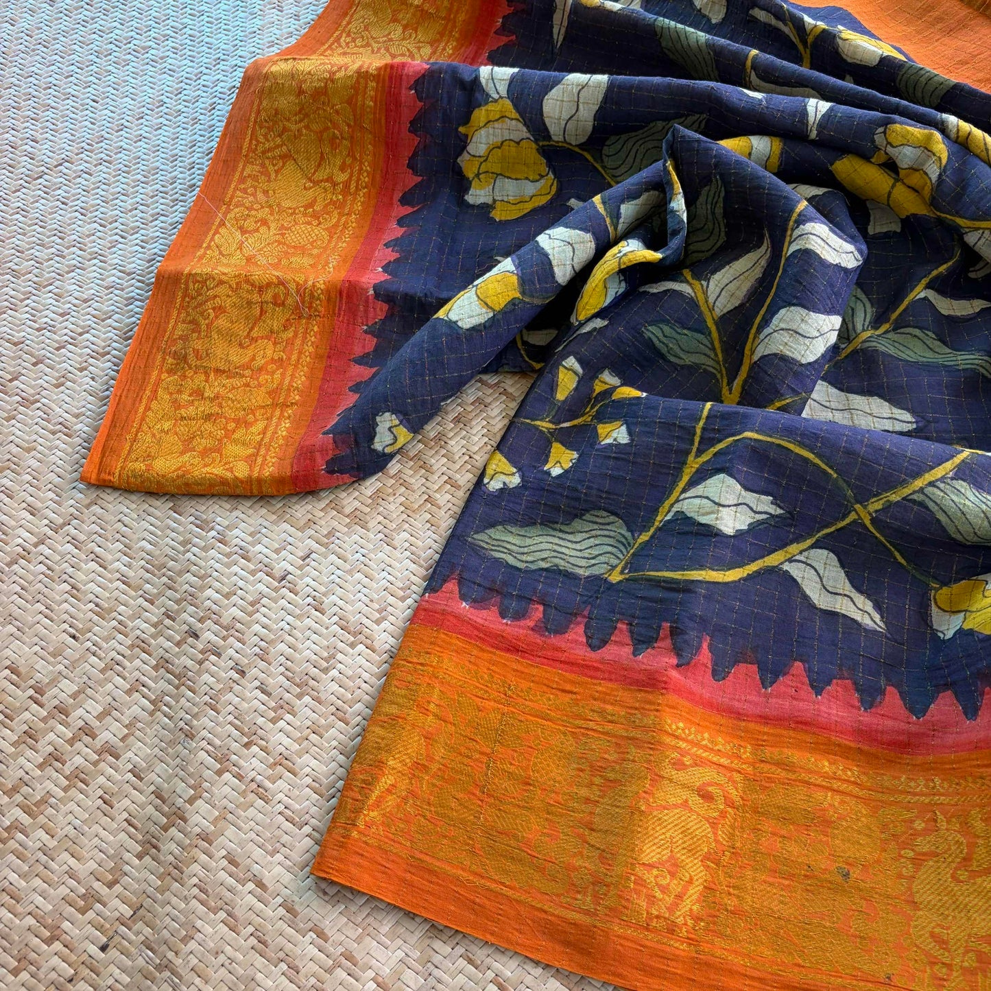 Black Floral Kalamkari Hand Painted on a Madurai Velthari Sungudi Cotton saree.