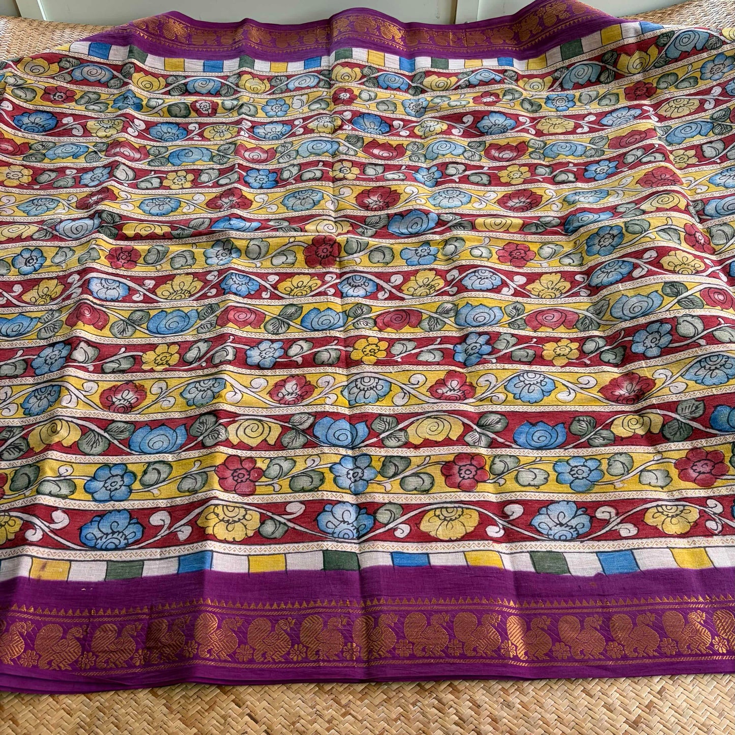 Multicoloured Kalamkari Hand Painted on a Madurai Velthari Sungudi Cotton saree.