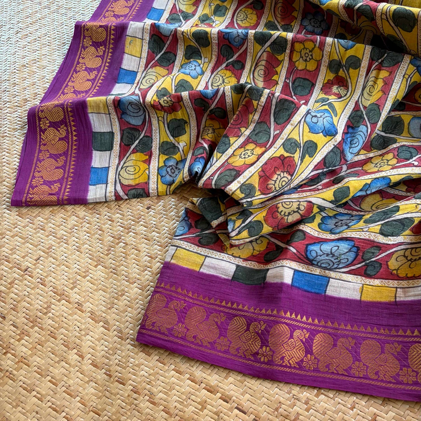 Multicoloured Kalamkari Hand Painted on a Madurai Velthari Sungudi Cotton saree.