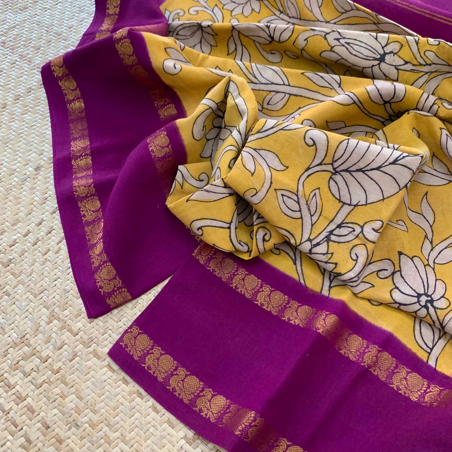 Floral Kalamkari Hand Painted on a Madurai Sungudi Cotton saree.