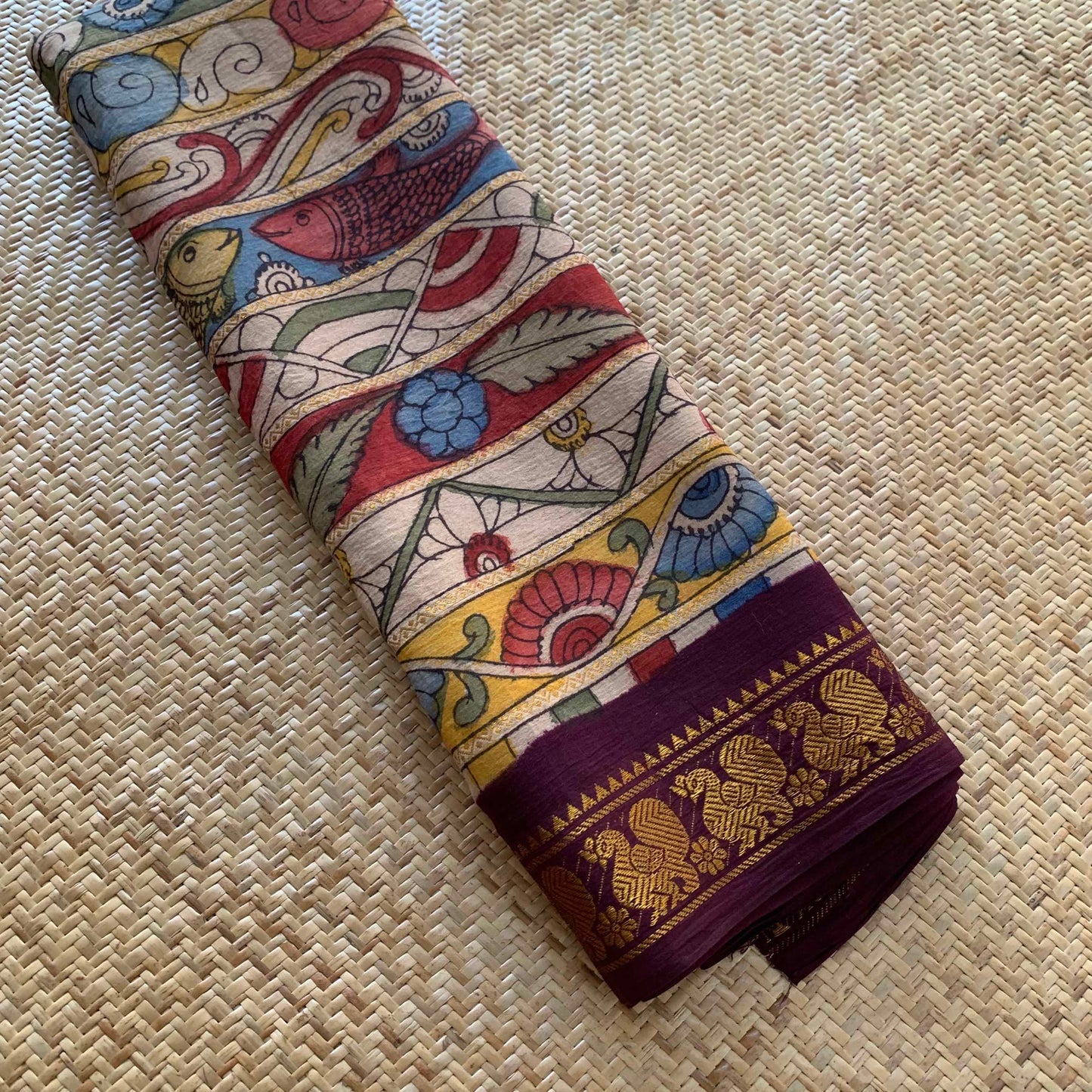 Multicoloured Kalamkari Hand Painted on a Madurai Velthari Sungudi Cotton saree.