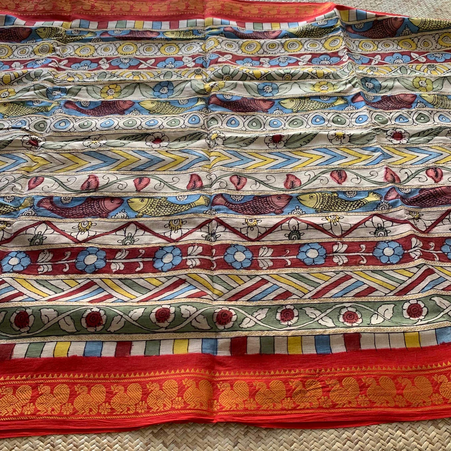 Multicoloured Kalamkari Hand Painted on a Madurai Velthari Sungudi Cotton saree.