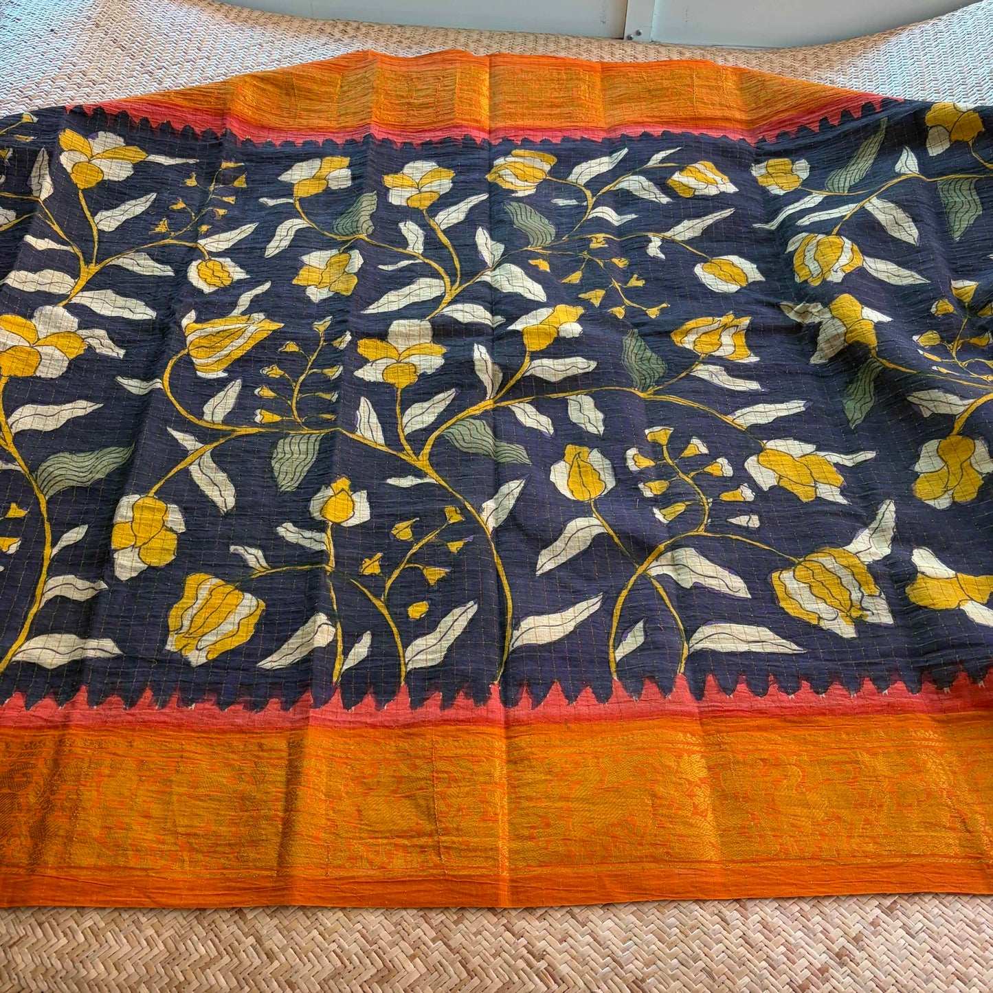 Black Floral Kalamkari Hand Painted on a Madurai Velthari Sungudi Cotton saree.