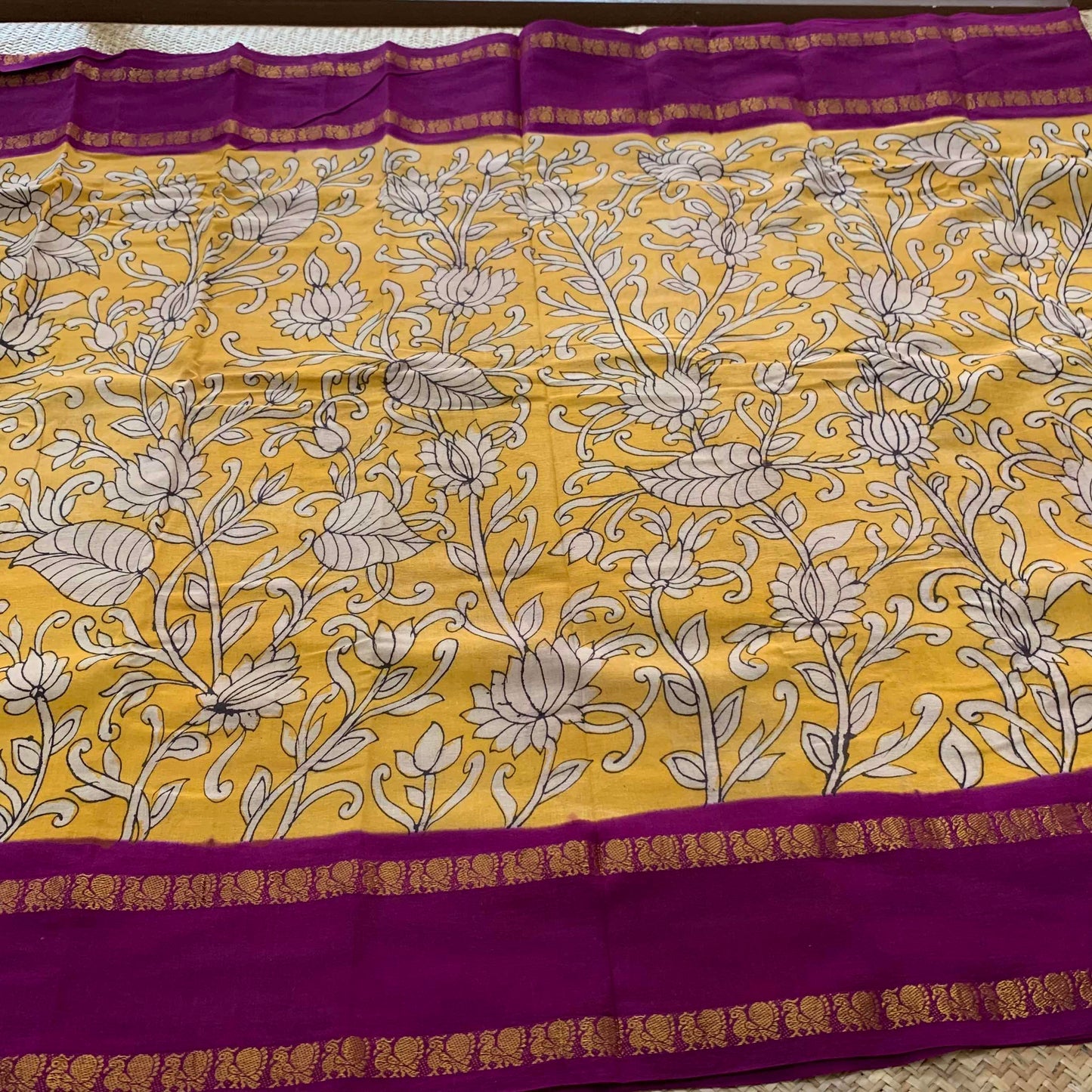 Floral Kalamkari Hand Painted on a Madurai Sungudi Cotton saree.