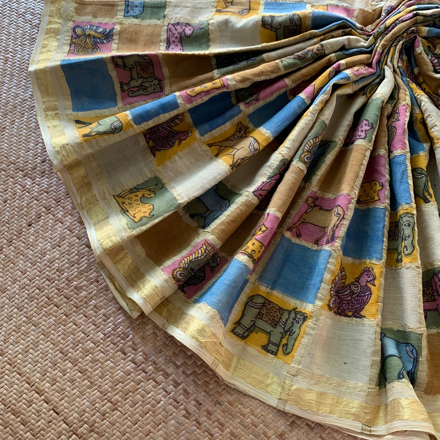 Flora and Fauna, Kalamkari Hand Painted on a Madurai Handwoven Sungudi Cotton saree.