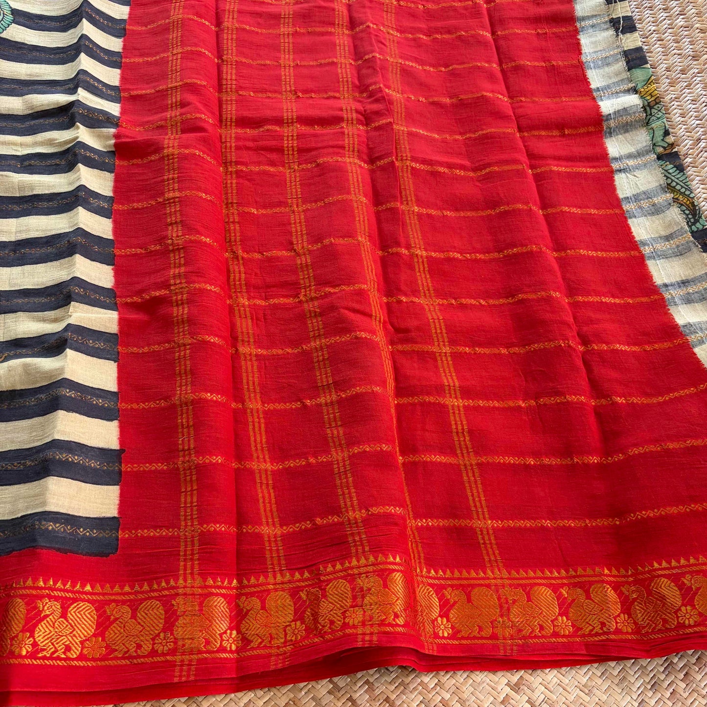 Multicoloured Kalamkari Hand Painted on a Madurai Velthari Sungudi Cotton saree.