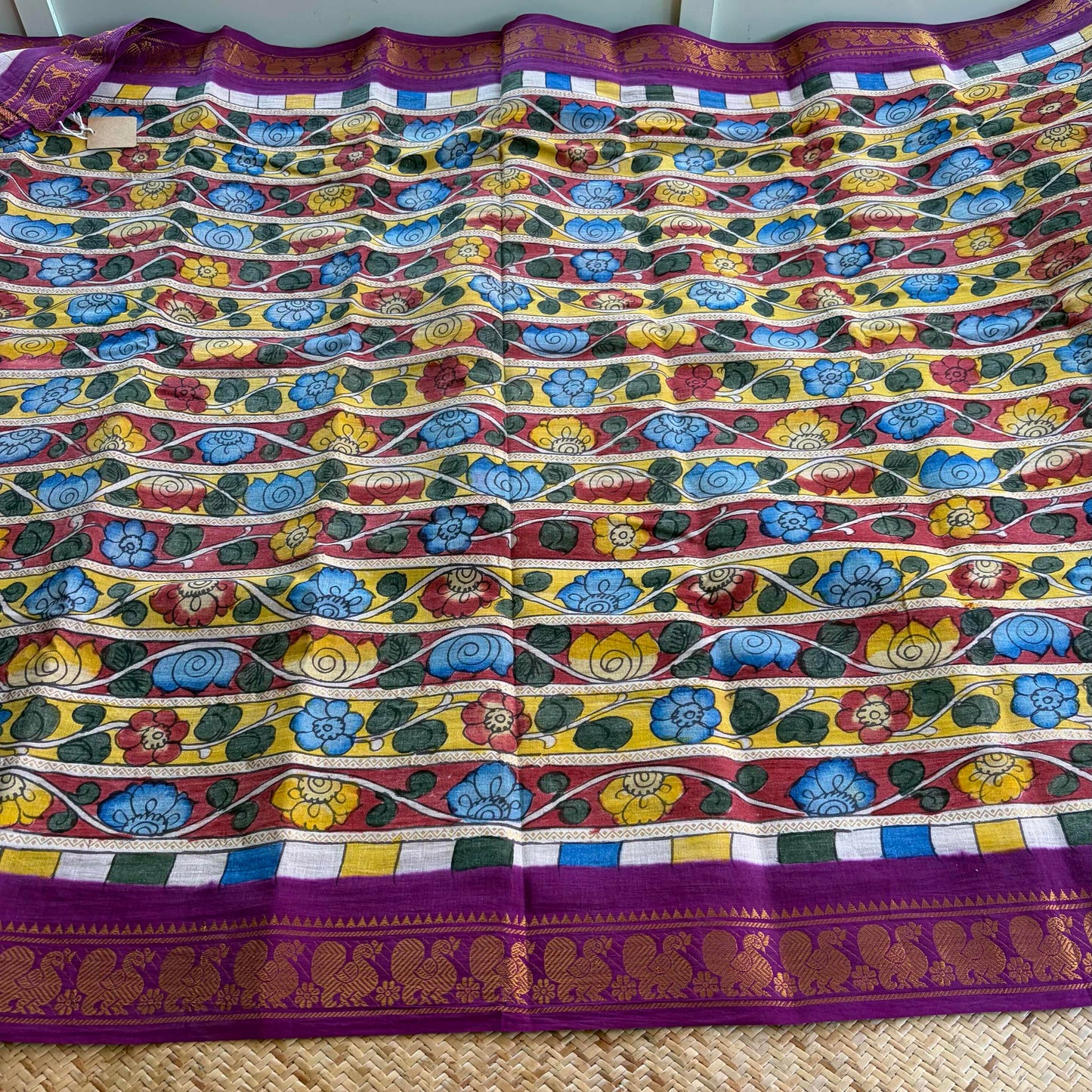 Multicoloured Kalamkari Hand Painted on a Madurai Velthari Sungudi Cotton saree.