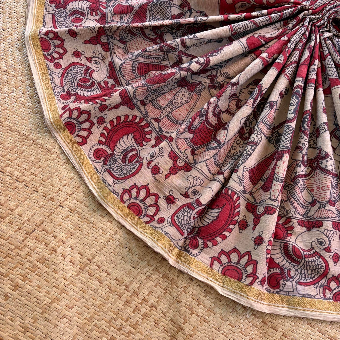 Red Floral Kalamkari Hand Painted on a Madurai Velthari Sungudi Cotton saree.