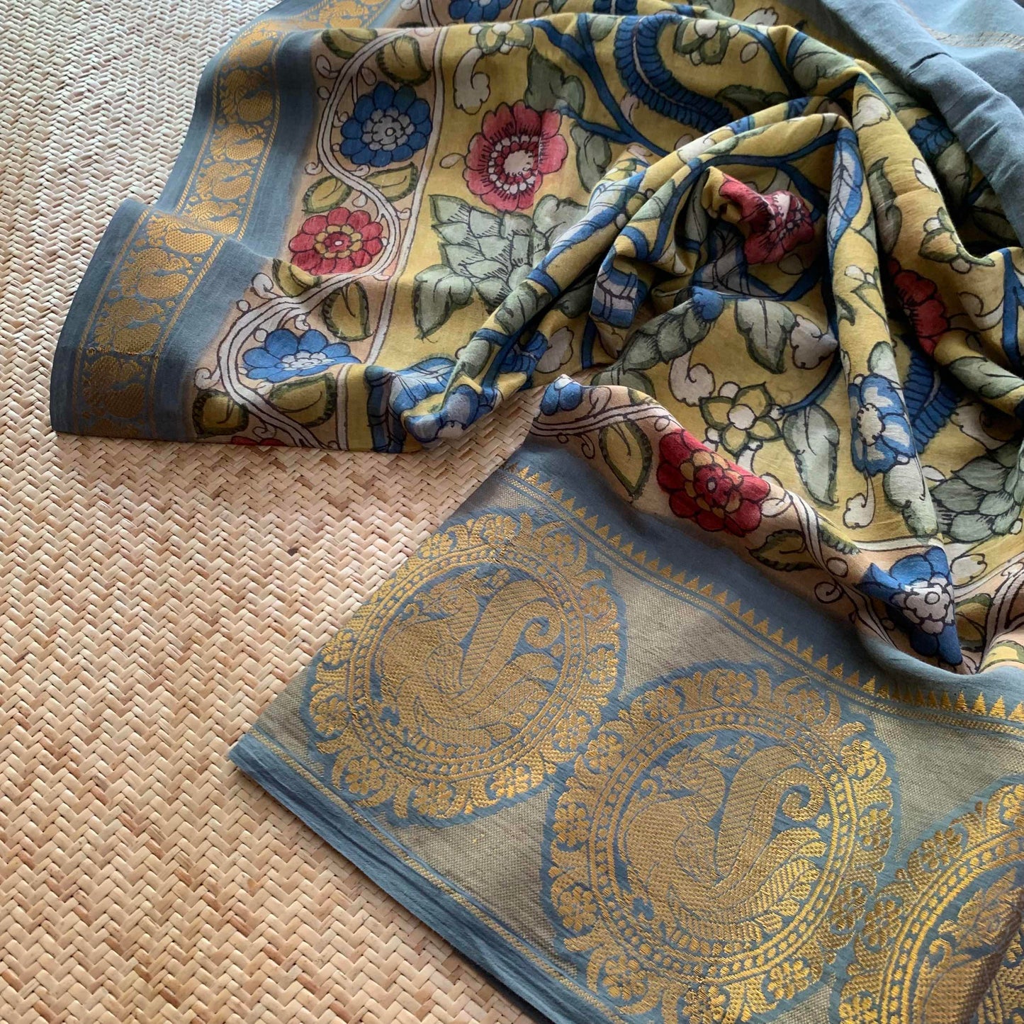 Grey Kalamkari Hand Painted on a Madurai Sungudi Cotton saree.