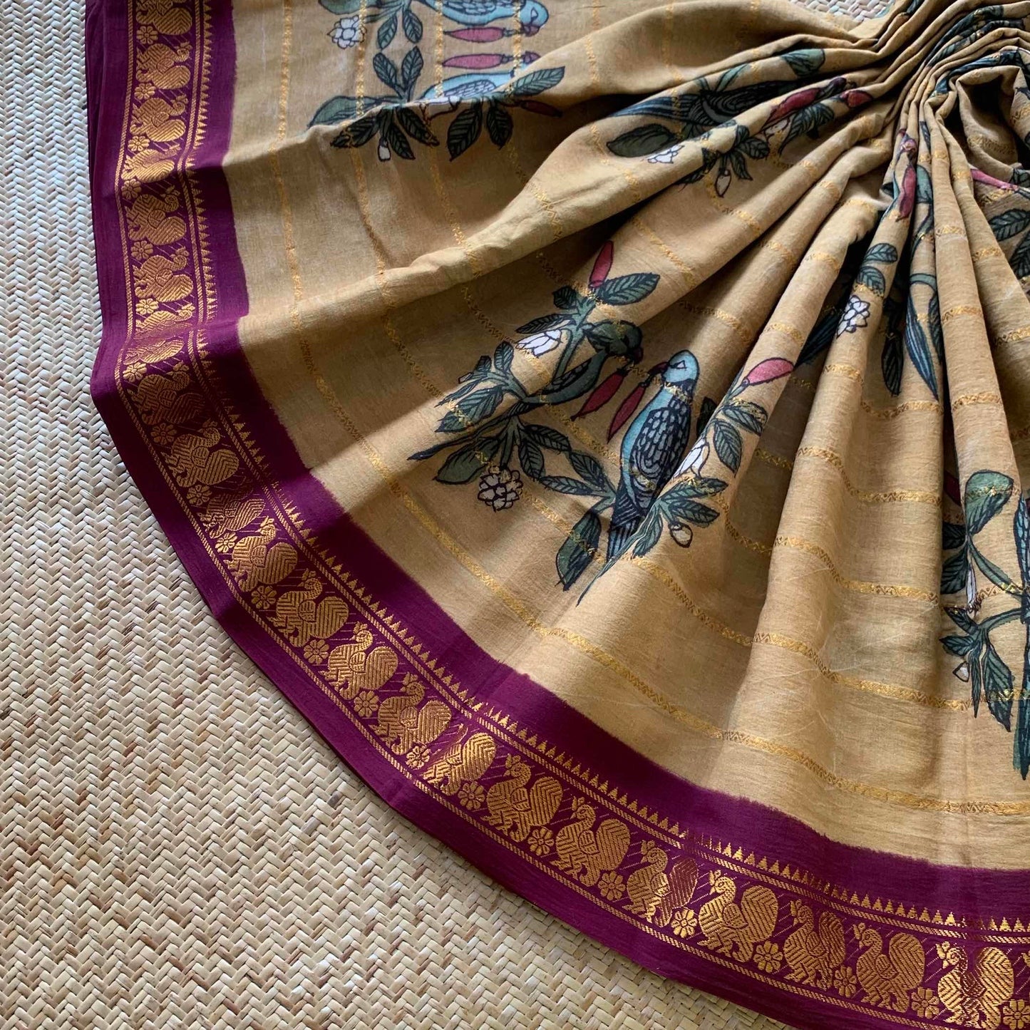 Parrot- chilli Kalamkari Hand Painted on a Madurai Velthari Sungudi Cotton saree.