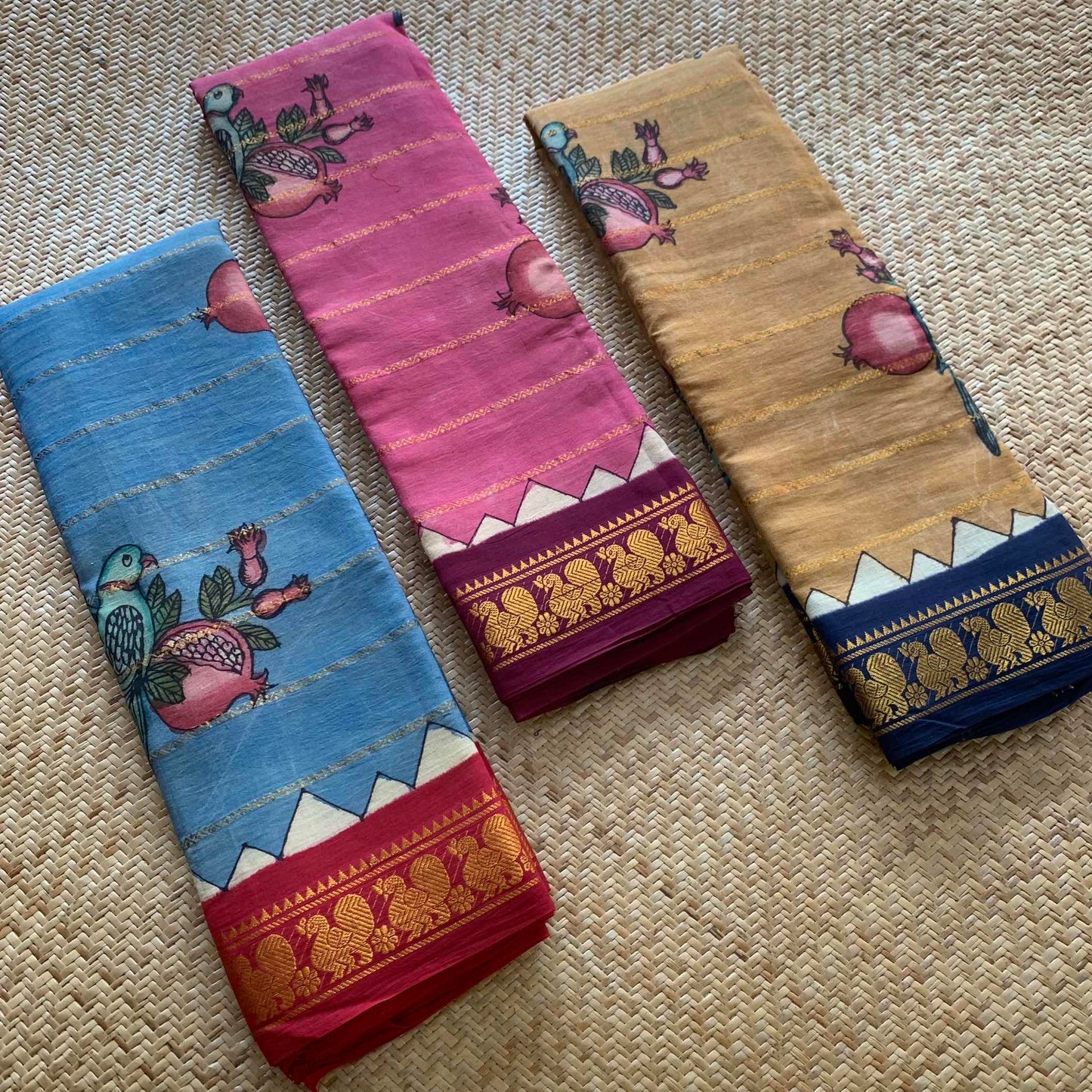 Parrot- Pomegranate Kalamkari Hand Painted on a Madurai Velthari Sungudi Cotton saree.