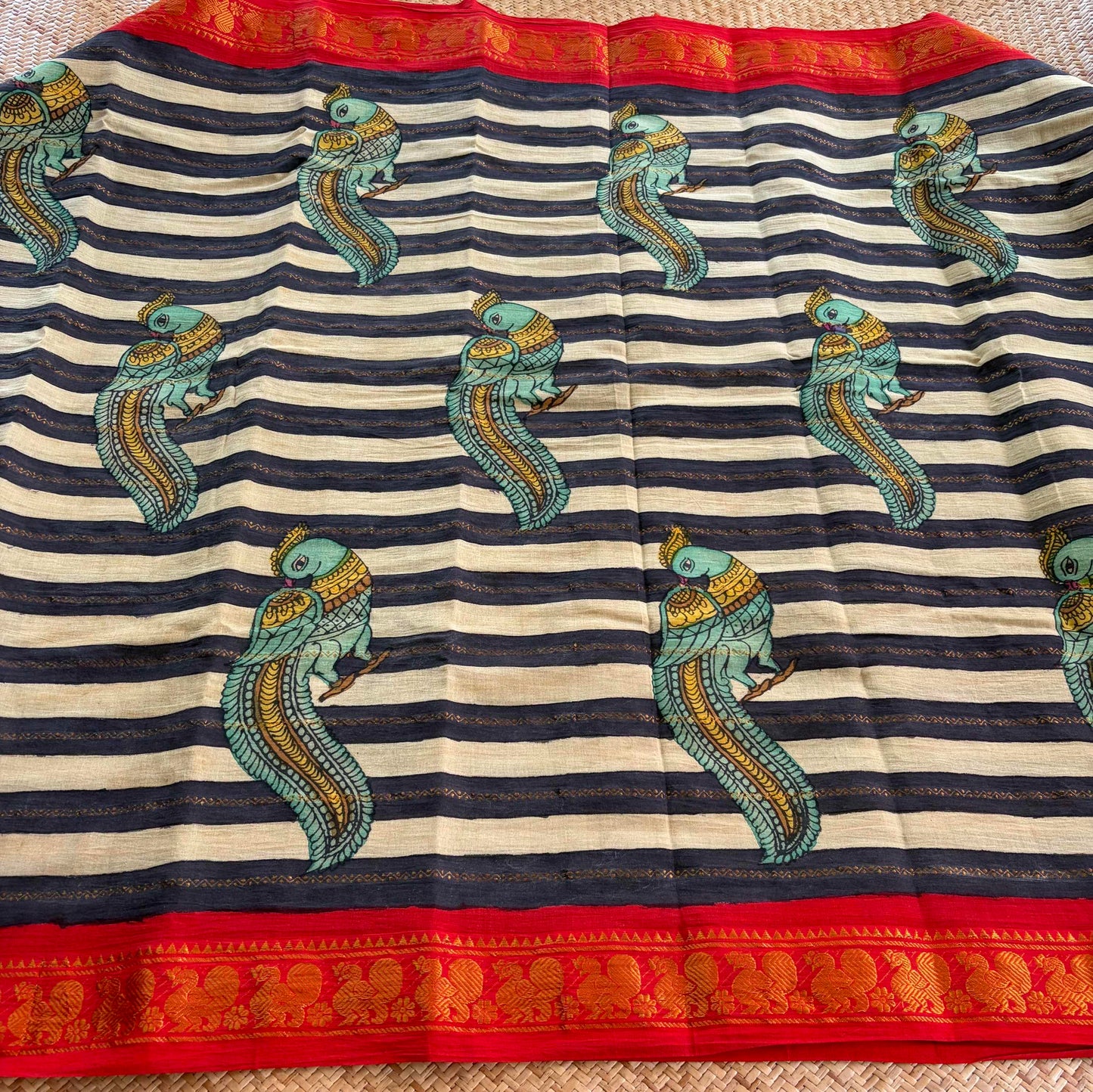 Multicoloured Kalamkari Hand Painted on a Madurai Velthari Sungudi Cotton saree.