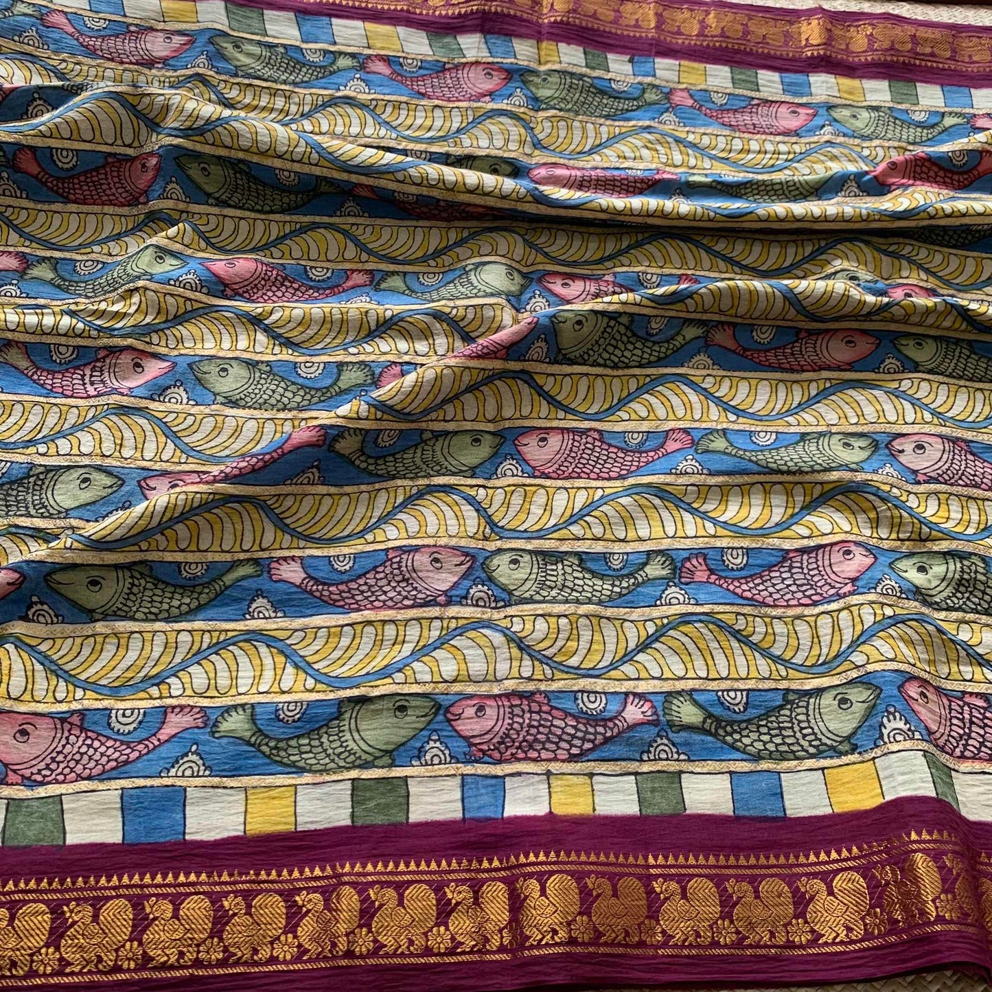 Multicoloured Kalamkari Hand Painted on a Madurai Velthari Sungudi Cotton saree.