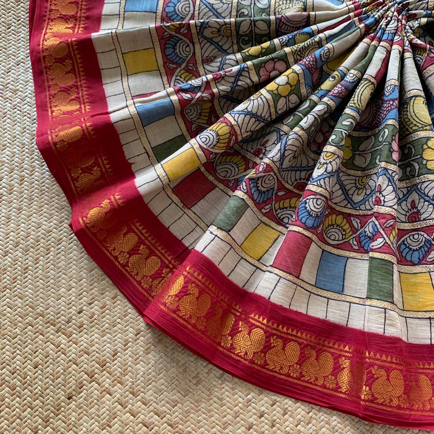 Multicoloured Kalamkari Hand Painted on a Madurai Velthari Sungudi Cotton saree.