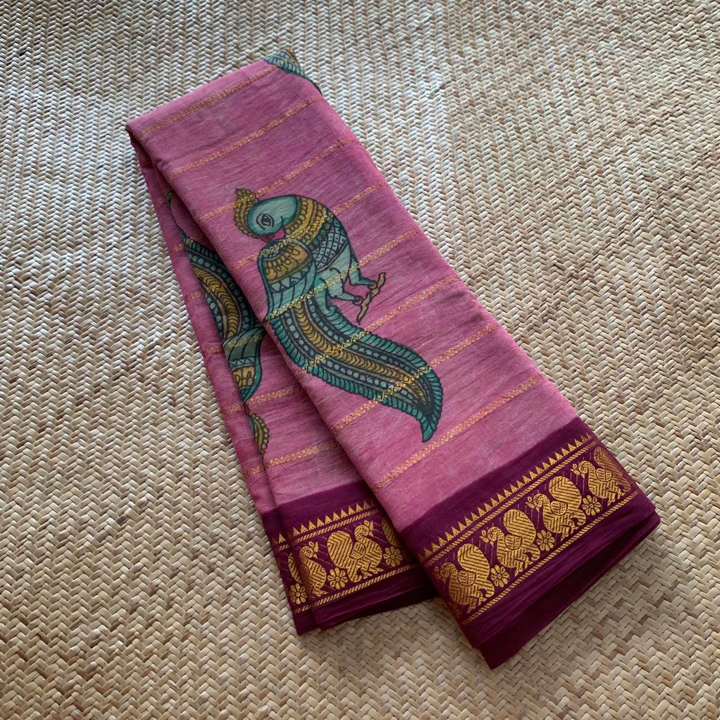 Classic Parrot- Kalamkari Hand Painted on a Madurai Velthari Sungudi Cotton saree.