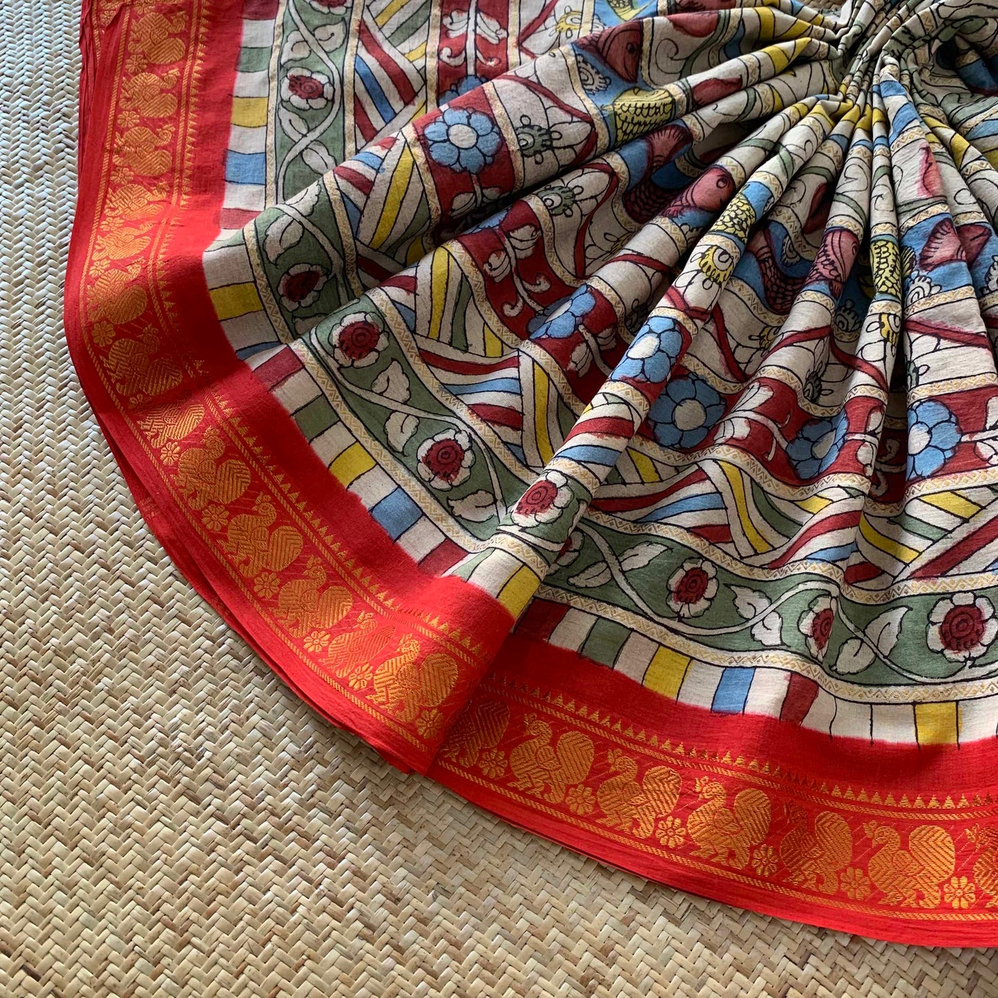 Multicoloured Kalamkari Hand Painted on a Madurai Velthari Sungudi Cotton saree.