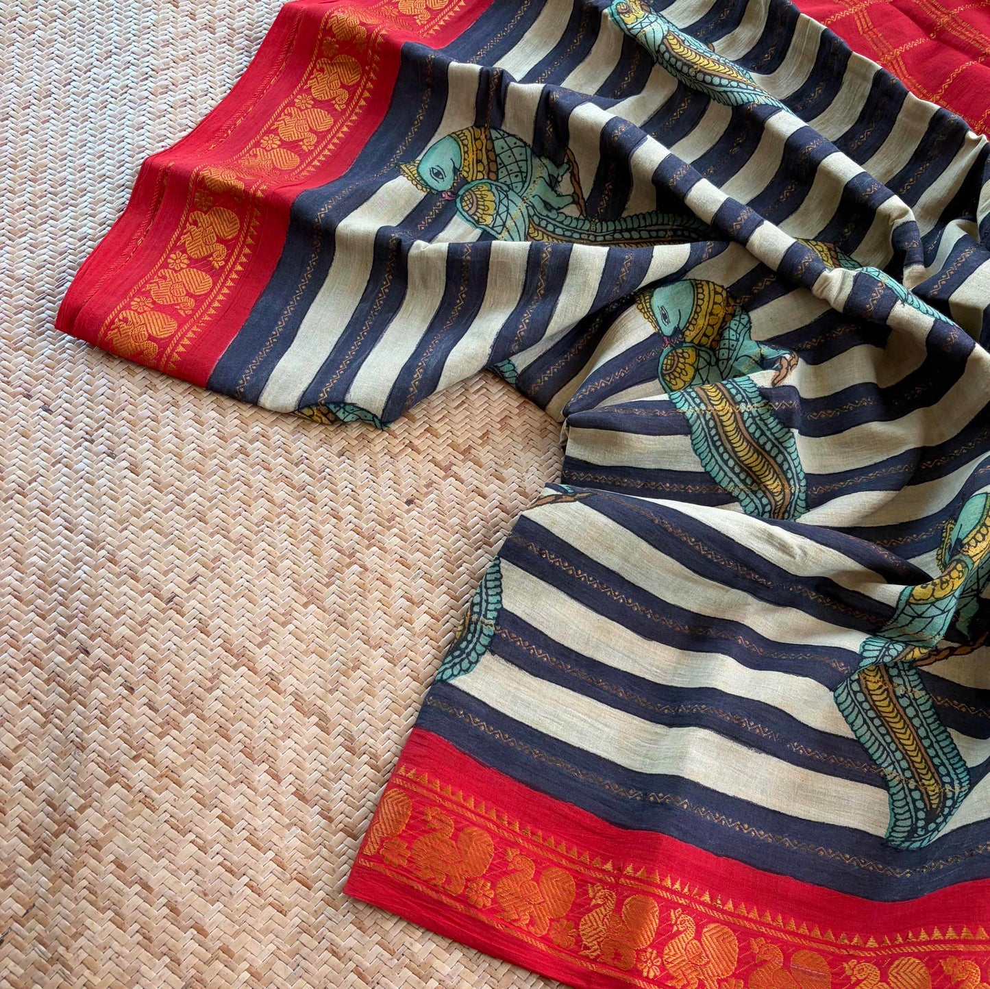 Multicoloured Kalamkari Hand Painted on a Madurai Velthari Sungudi Cotton saree.