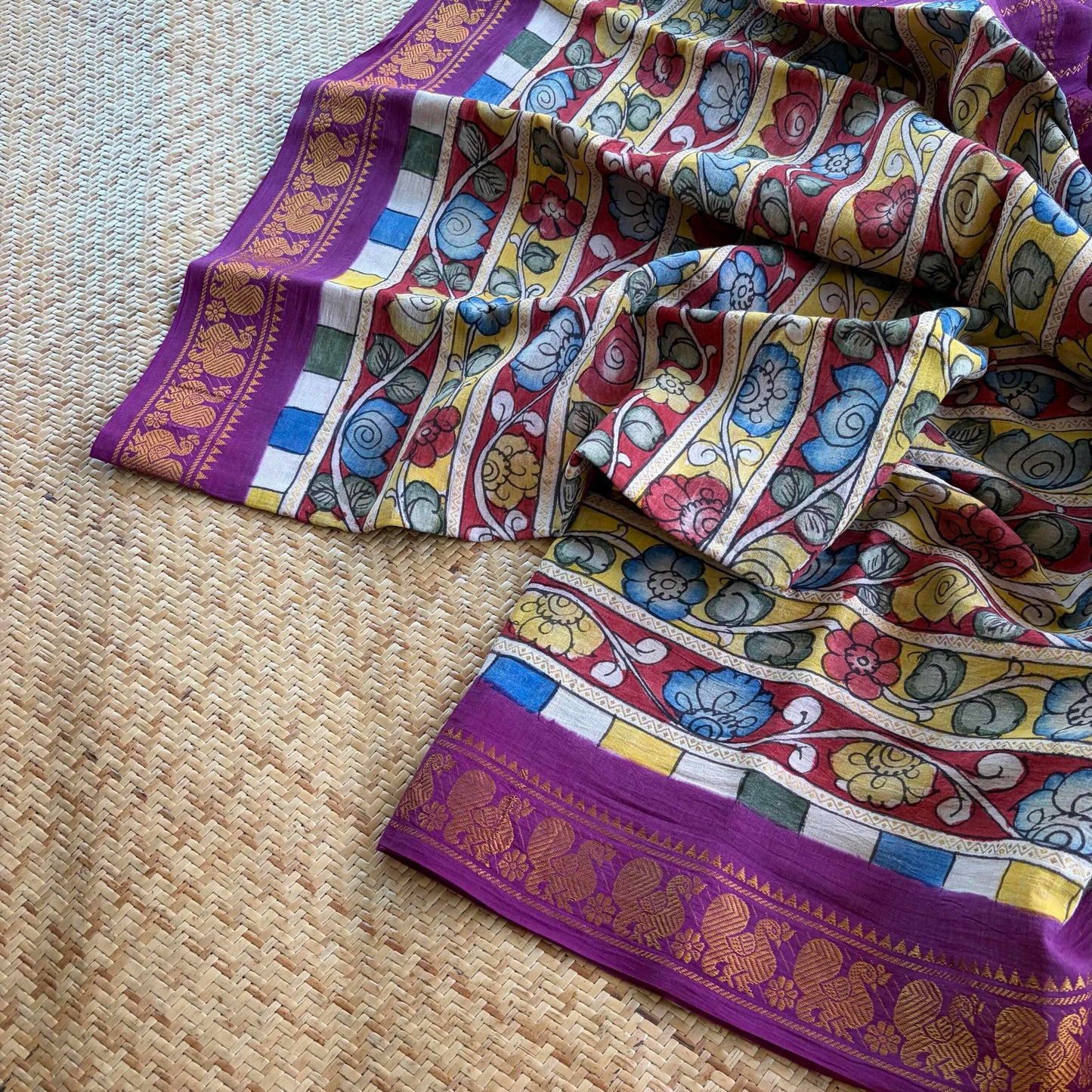 Multicoloured Kalamkari Hand Painted on a Madurai Velthari Sungudi Cotton saree.