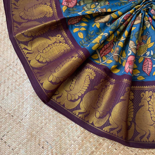 Blue Kalamkari Hand Painted on a Madurai Sungudi Cotton saree.